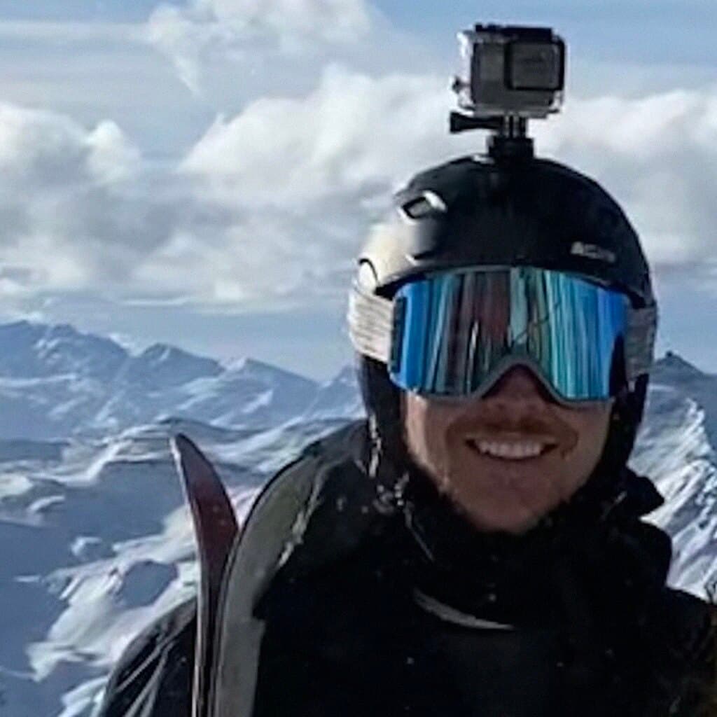 Tyler Dreher skiing in the mountains